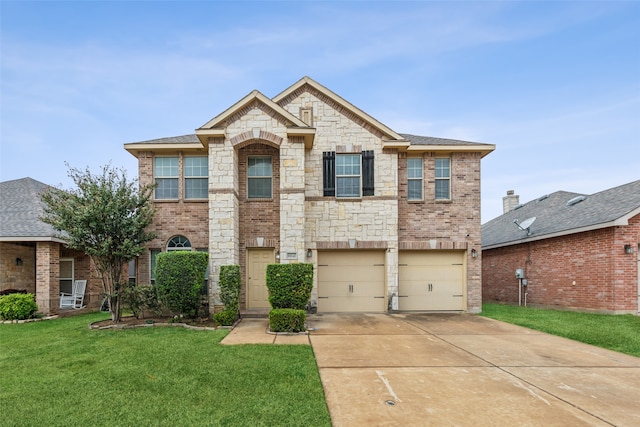 view of front of home featuring a front lawn and a garage