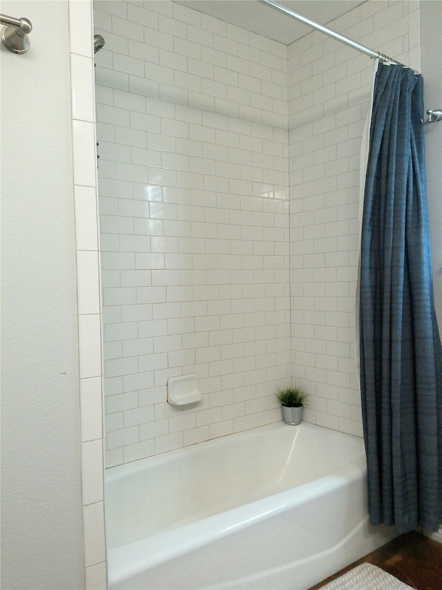 bathroom featuring shower / bath combo with shower curtain