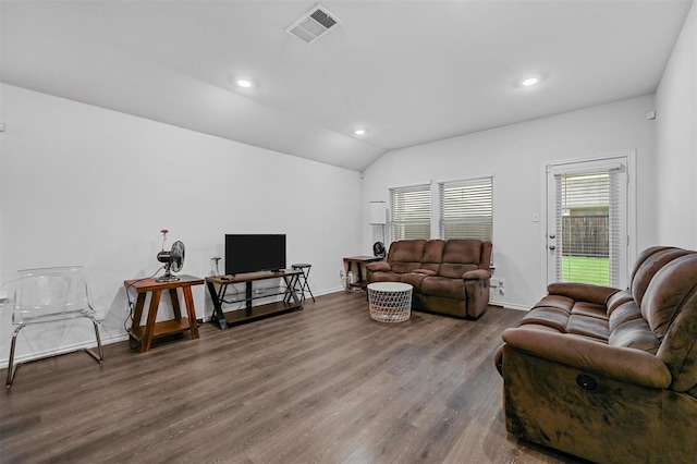 living room with lofted ceiling and hardwood / wood-style floors