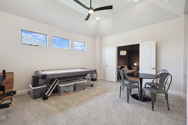 interior space featuring carpet flooring, ceiling fan, and high vaulted ceiling