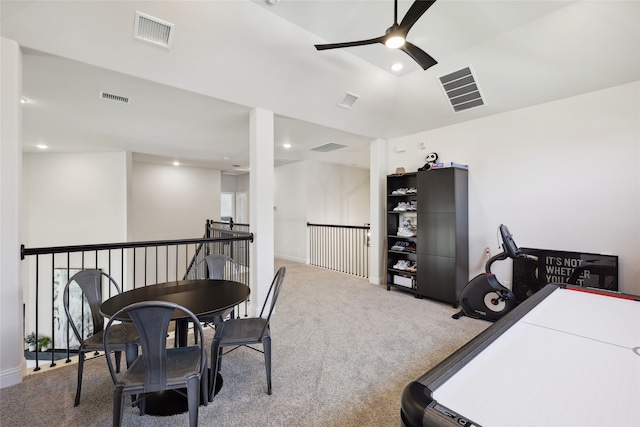 carpeted office space with ceiling fan