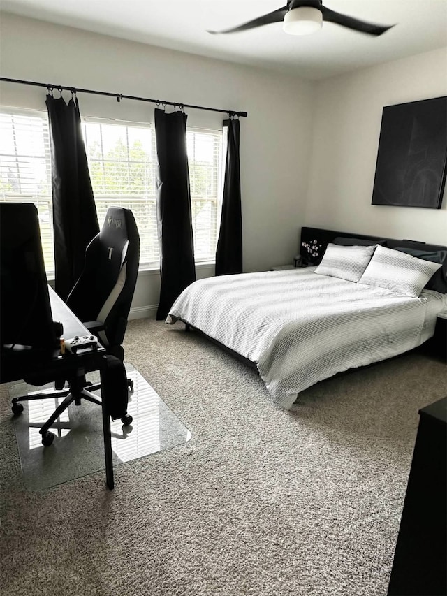 carpeted bedroom featuring ceiling fan