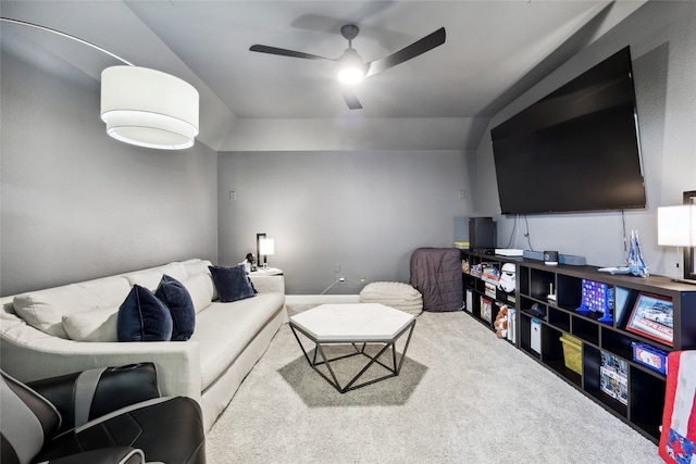 living room with carpet flooring, ceiling fan, and lofted ceiling