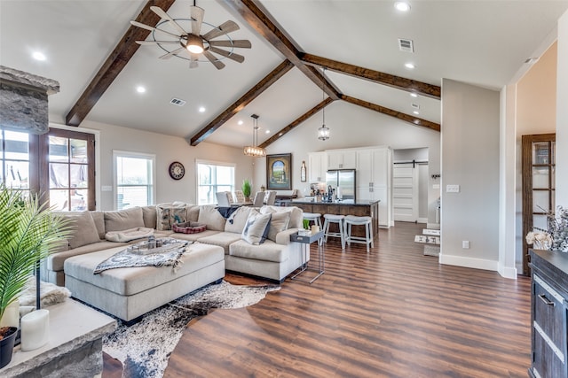 living room featuring beam ceiling, ceiling fan, a barn door, high vaulted ceiling, and dark wood-type flooring