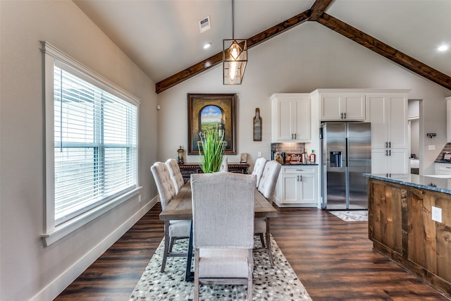 dining space with vaulted ceiling with beams and dark hardwood / wood-style floors