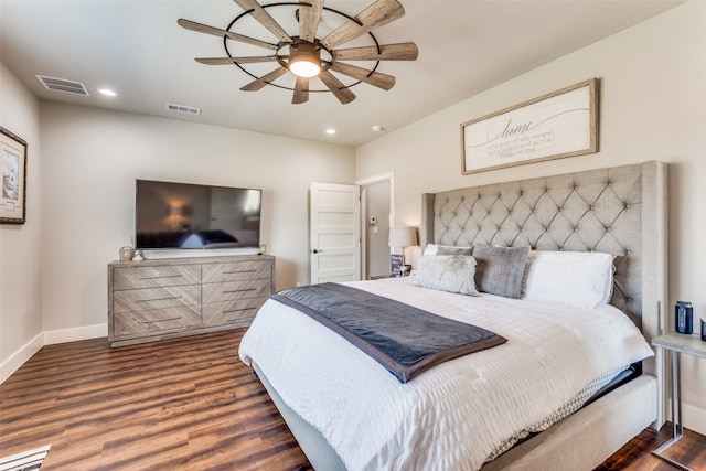 bedroom featuring dark hardwood / wood-style floors and ceiling fan