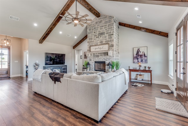 living room with beamed ceiling, high vaulted ceiling, a fireplace, and dark hardwood / wood-style flooring