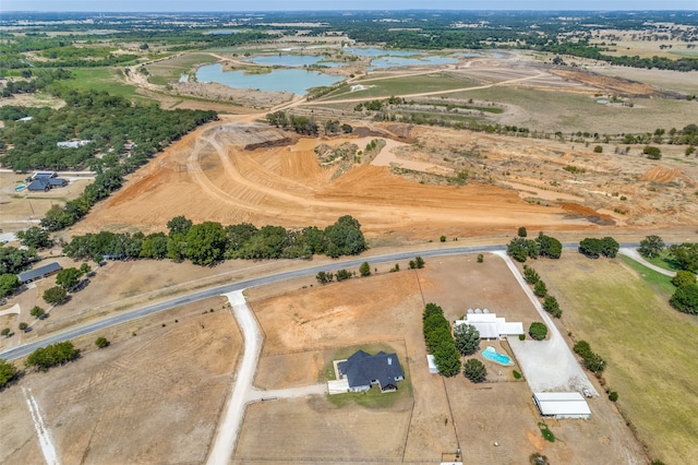 bird's eye view with a rural view and a water view