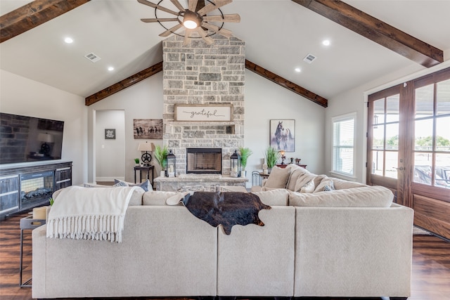 living room featuring french doors, beam ceiling, dark hardwood / wood-style flooring, and a fireplace