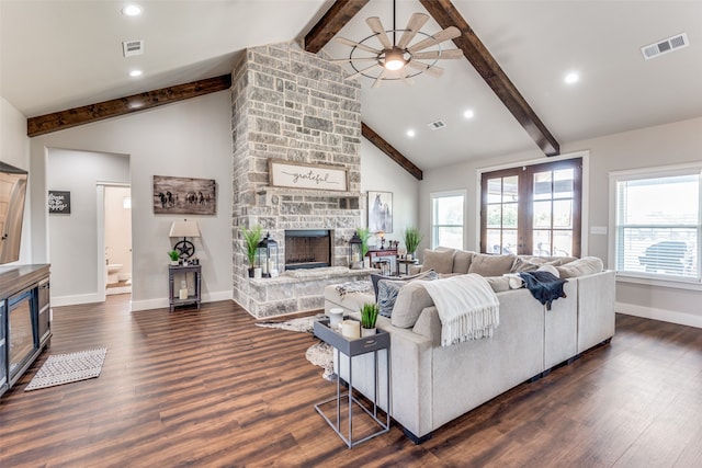 living room featuring beam ceiling, ceiling fan, high vaulted ceiling, dark hardwood / wood-style floors, and a fireplace