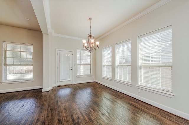 unfurnished dining area with dark hardwood / wood-style flooring, ornamental molding, and plenty of natural light