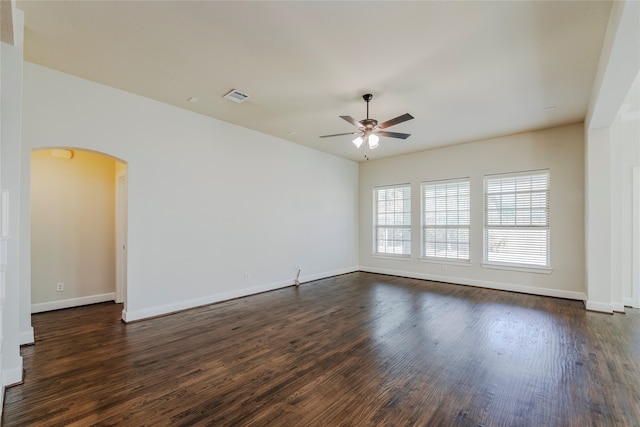 unfurnished room featuring dark hardwood / wood-style floors and ceiling fan