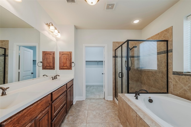 bathroom with vanity, shower with separate bathtub, and tile patterned flooring