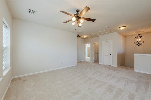 unfurnished room featuring light carpet and plenty of natural light