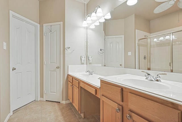 bathroom with vanity, a shower with shower door, tile patterned floors, and ceiling fan