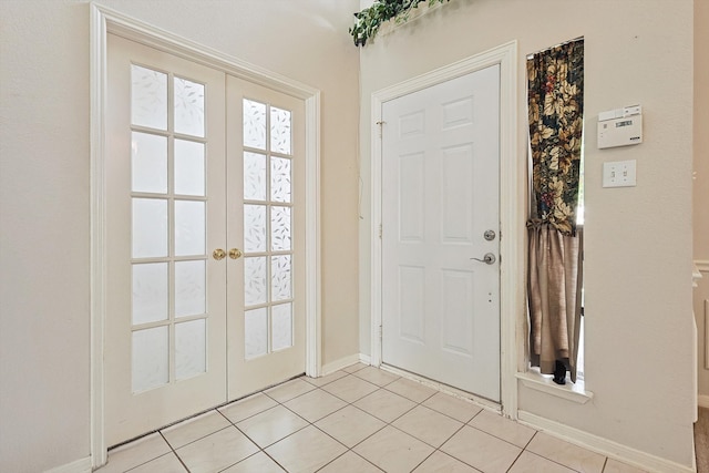 doorway featuring french doors and light tile patterned flooring