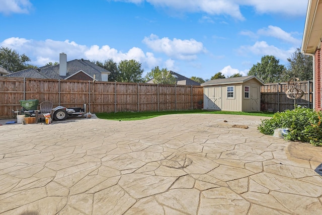 view of patio featuring a shed