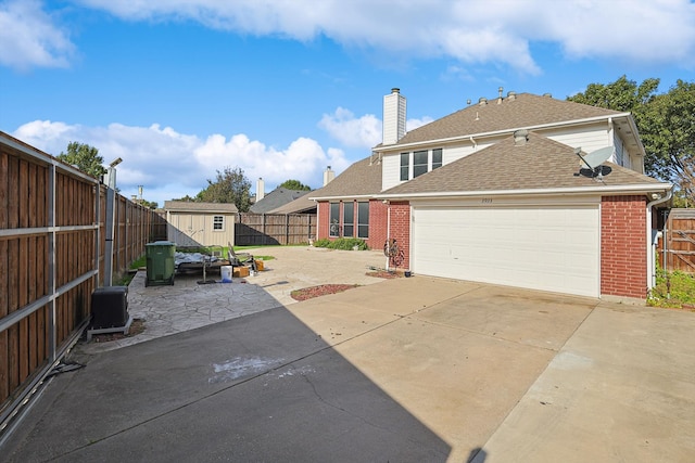 exterior space featuring a patio and a storage shed