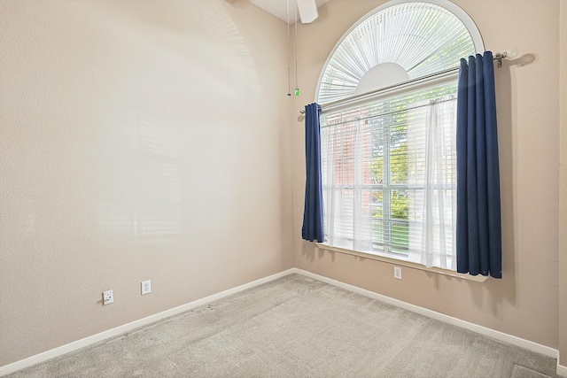 carpeted empty room with ceiling fan