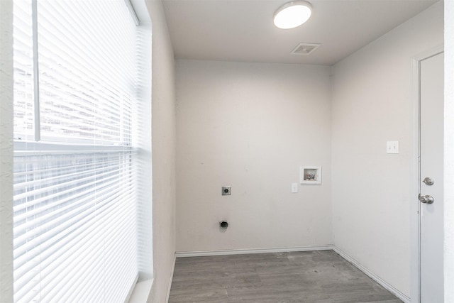 washroom with electric dryer hookup, washer hookup, and wood-type flooring