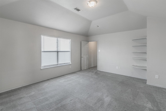 unfurnished bedroom featuring carpet floors and lofted ceiling