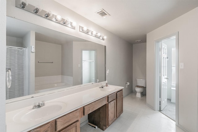 bathroom with vanity, toilet, and a washtub