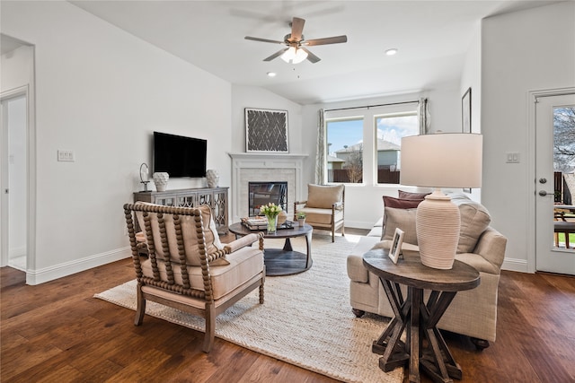 living room with vaulted ceiling, ceiling fan, and dark hardwood / wood-style flooring