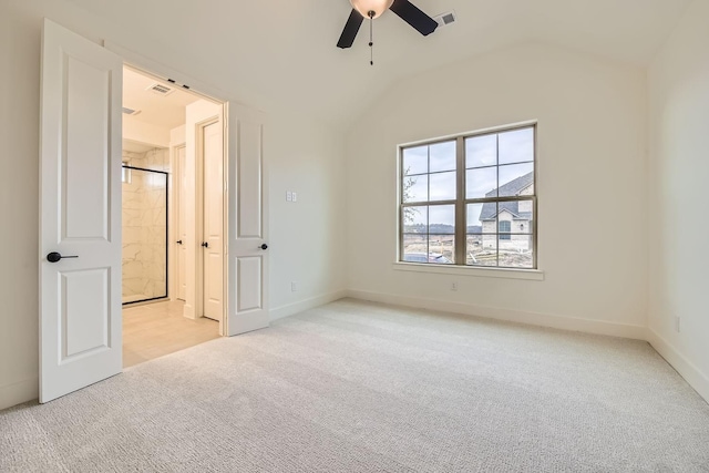 unfurnished bedroom with lofted ceiling, light carpet, and ceiling fan