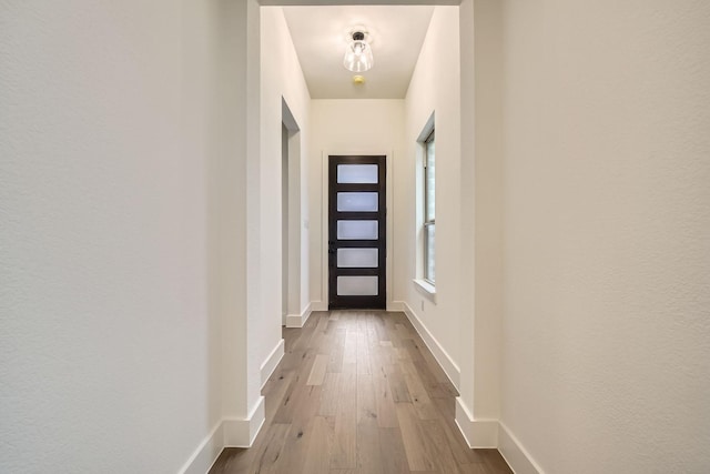 entryway with hardwood / wood-style flooring