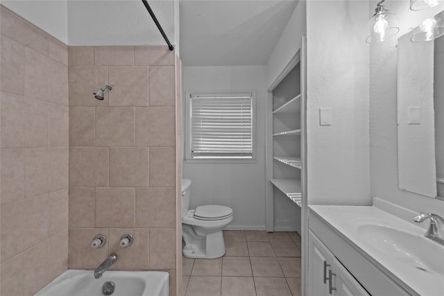 full bathroom with toilet, vanity, tiled shower / bath combo, and tile patterned floors