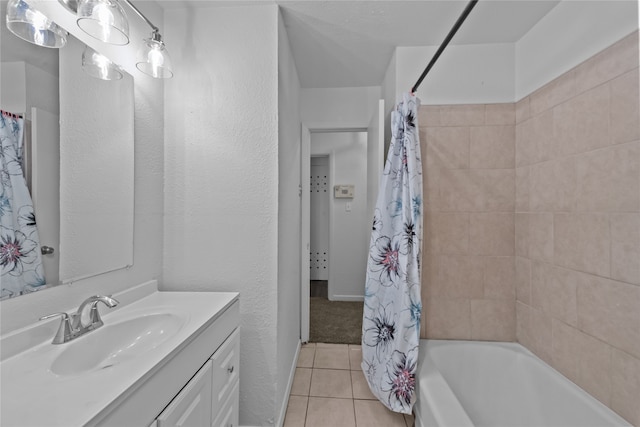 bathroom with vanity, shower / tub combo with curtain, and tile patterned floors