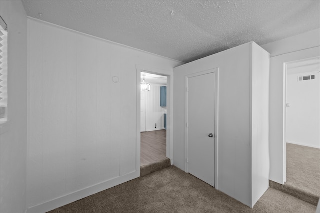 interior space featuring a textured ceiling