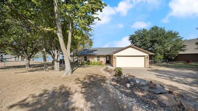 ranch-style house featuring a garage