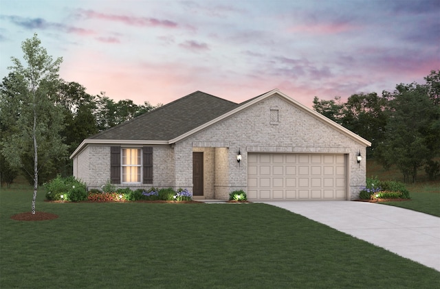 view of front facade featuring a garage and a yard