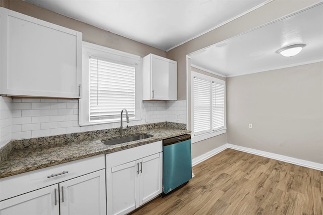 kitchen with sink, dishwasher, white cabinets, and light wood-type flooring