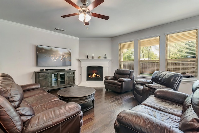 living room featuring ornamental molding, hardwood / wood-style flooring, and ceiling fan