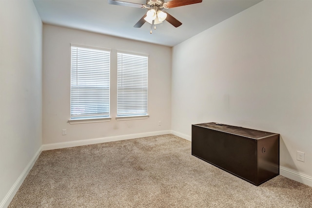 carpeted empty room with ceiling fan