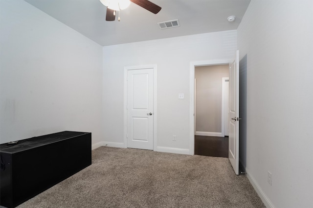 bedroom with ceiling fan and carpet floors