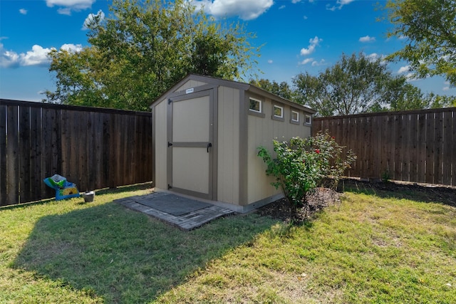 view of outdoor structure featuring a lawn