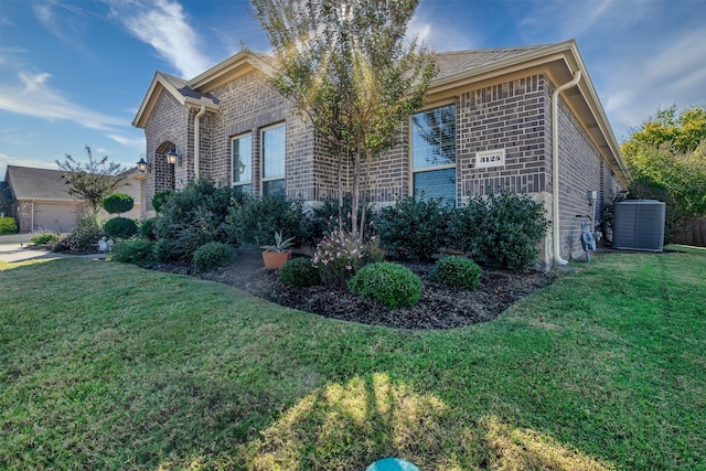 view of side of home featuring a yard