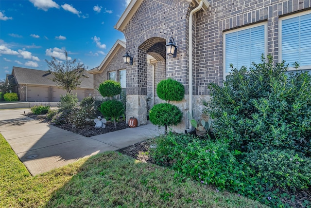 view of exterior entry featuring a garage