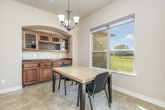 dining room featuring a chandelier