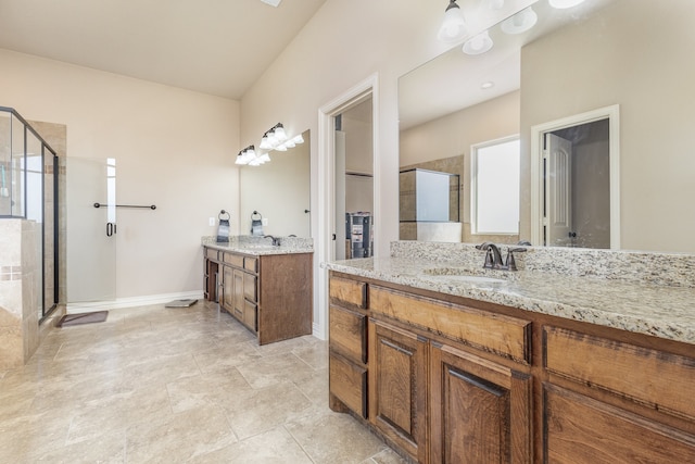 bathroom featuring vanity and an enclosed shower