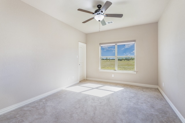 empty room with light carpet and ceiling fan