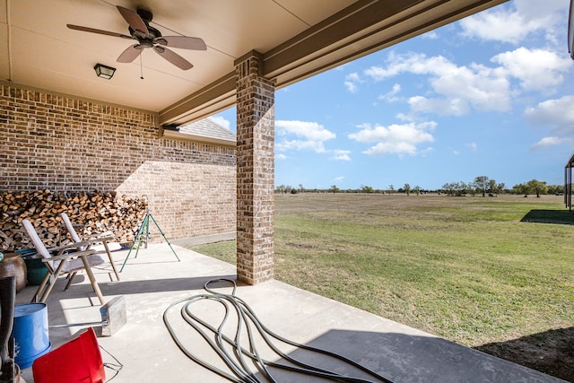 view of patio / terrace featuring a rural view and ceiling fan