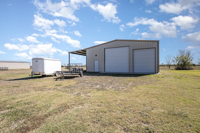 garage featuring a lawn