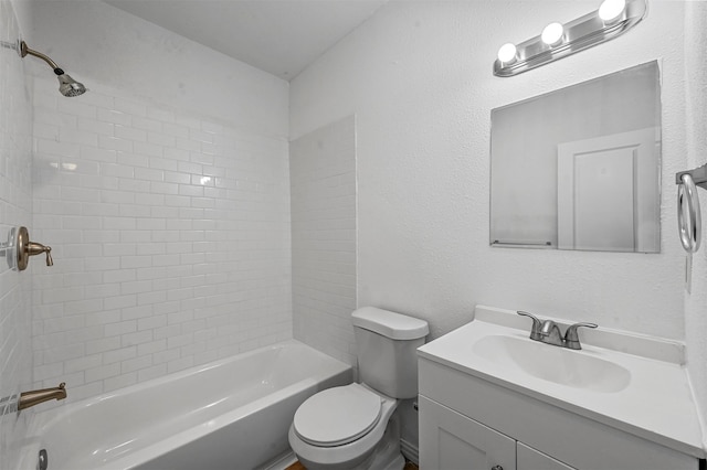 full bathroom with vanity, toilet, and tiled shower / bath