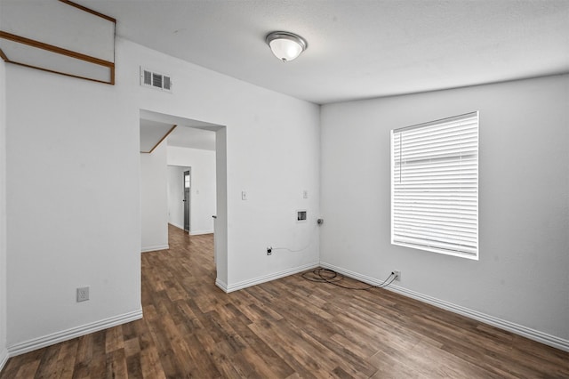 spare room with dark wood-type flooring