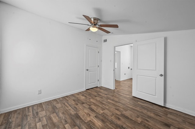 unfurnished bedroom featuring vaulted ceiling, dark hardwood / wood-style floors, and ceiling fan