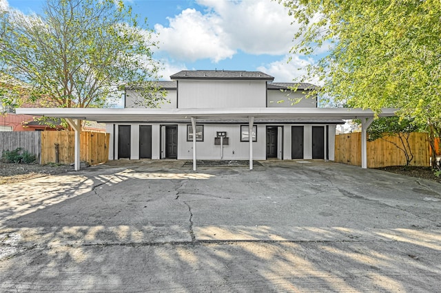 rear view of house featuring a carport